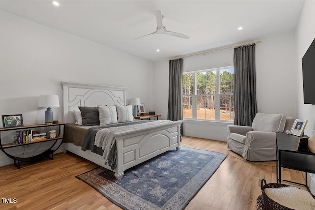 bedroom featuring light hardwood / wood-style floors and ceiling fan