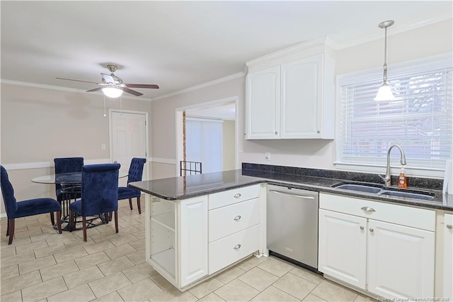 kitchen featuring white cabinetry, sink, decorative light fixtures, and dishwasher