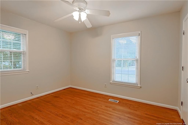 spare room with ceiling fan and light hardwood / wood-style floors