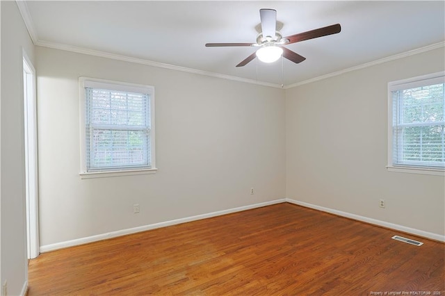 unfurnished room featuring ceiling fan, ornamental molding, and wood-type flooring