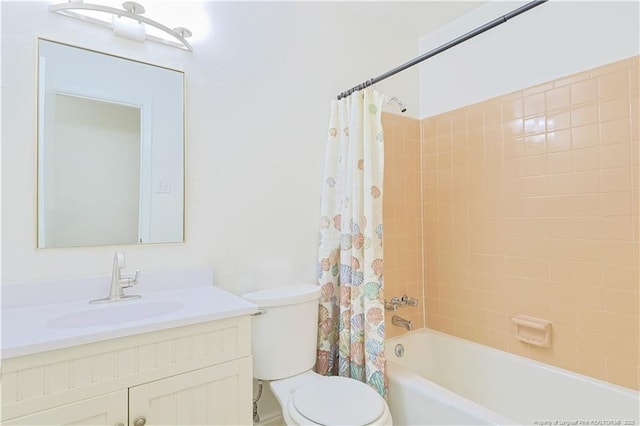 full bathroom featuring shower / tub combo, vanity, and toilet