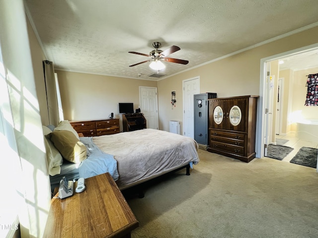 bedroom featuring crown molding, light colored carpet, and a textured ceiling