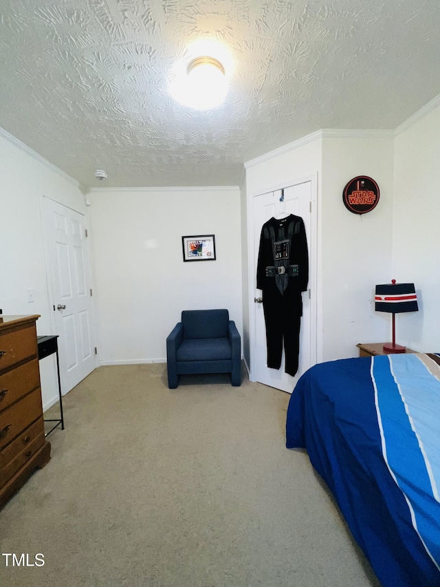 bedroom with crown molding, a closet, a textured ceiling, and carpet flooring