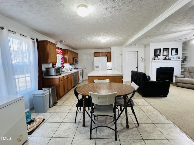 carpeted dining area featuring built in features and a textured ceiling