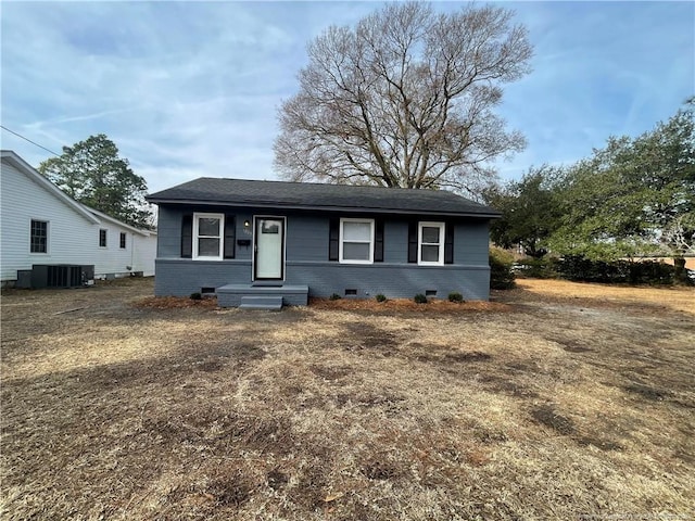 bungalow-style house with cooling unit