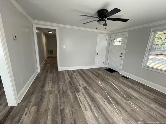 entrance foyer with ceiling fan, ornamental molding, and dark hardwood / wood-style floors