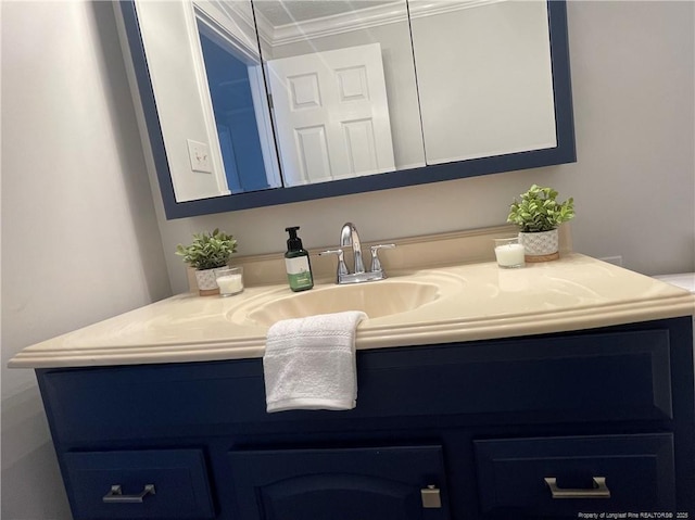 bathroom with vanity and crown molding