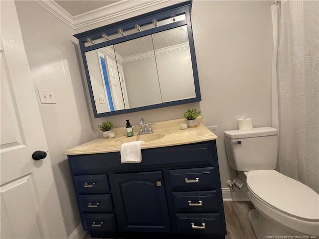 bathroom with vanity, wood-type flooring, ornamental molding, and toilet