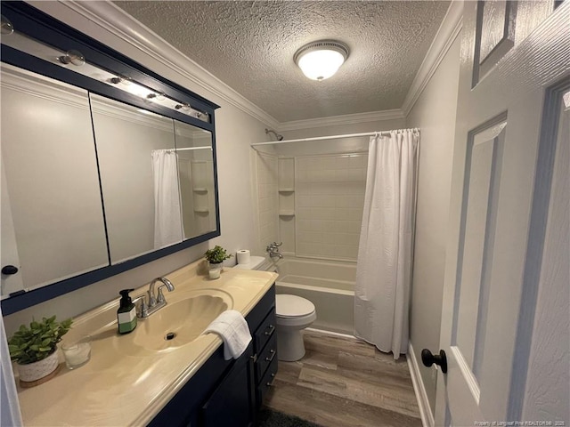 full bathroom with ornamental molding, hardwood / wood-style floors, vanity, and shower / bath combo with shower curtain