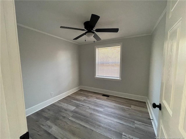 empty room with crown molding, hardwood / wood-style floors, and ceiling fan