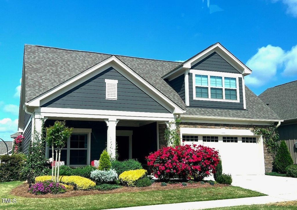 craftsman house featuring a garage