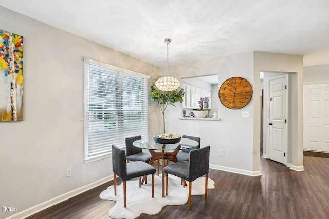 dining area with dark hardwood / wood-style floors