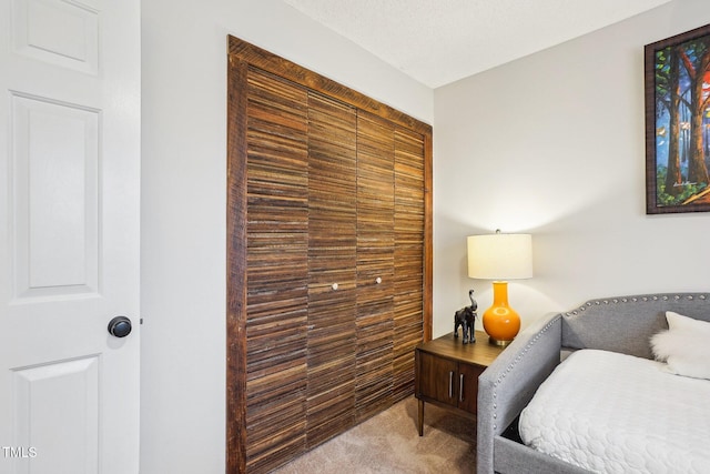 carpeted bedroom with a textured ceiling