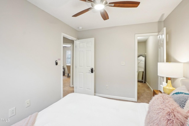 bedroom featuring light colored carpet and ceiling fan