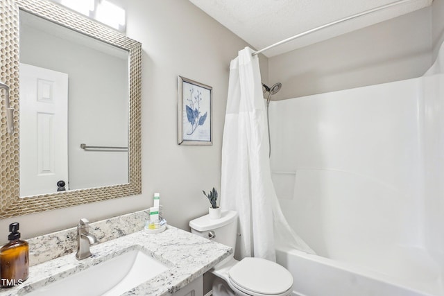 full bathroom featuring shower / tub combo, vanity, and toilet