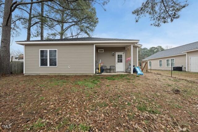 back of house with a patio area