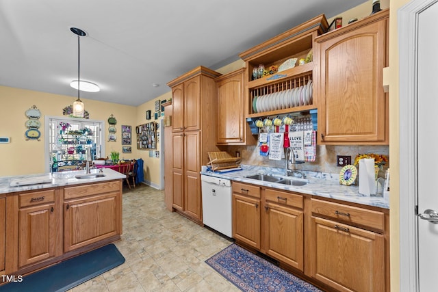 kitchen with decorative light fixtures, dishwasher, a sink, and open shelves