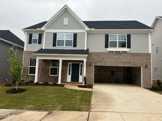 view of front of property featuring a garage and a front yard