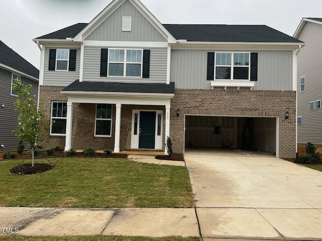 view of front of house featuring a garage and a front yard