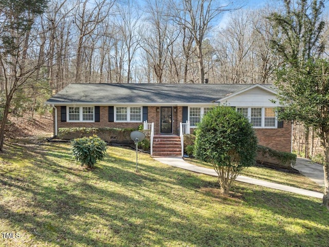 single story home with a front lawn