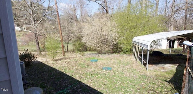 view of yard with a carport