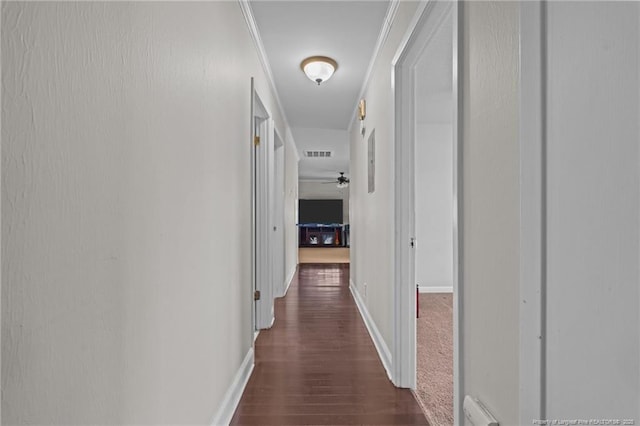 hallway featuring a baseboard heating unit and dark wood-type flooring