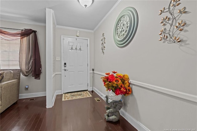 foyer featuring ornamental molding and dark hardwood / wood-style flooring