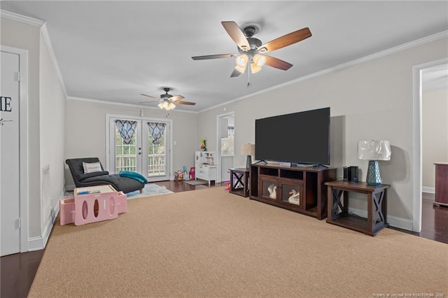 playroom with wood-type flooring, ornamental molding, french doors, and ceiling fan