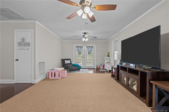 rec room with crown molding, ceiling fan, wood-type flooring, and french doors