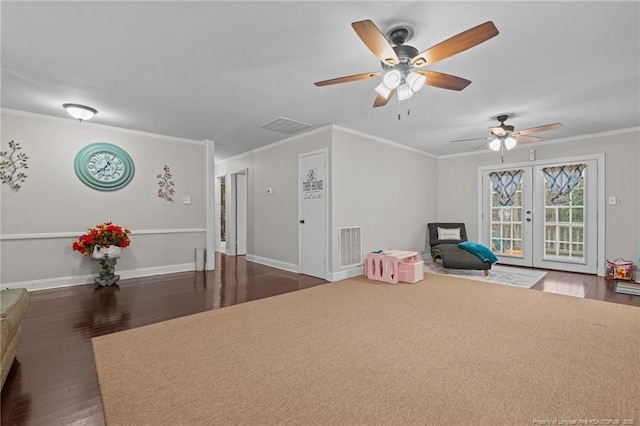 rec room featuring crown molding, dark hardwood / wood-style floors, and french doors