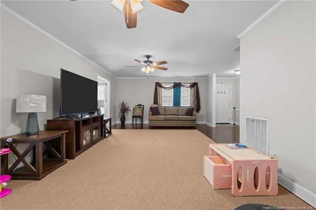 living room with crown molding and ceiling fan