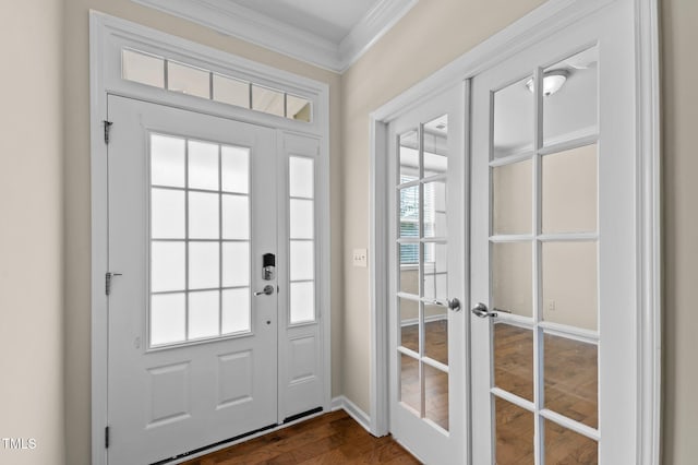 doorway to outside with baseboards, dark wood-type flooring, crown molding, and french doors