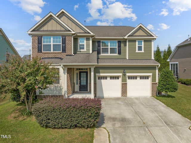 craftsman inspired home with driveway, an attached garage, a front lawn, board and batten siding, and brick siding