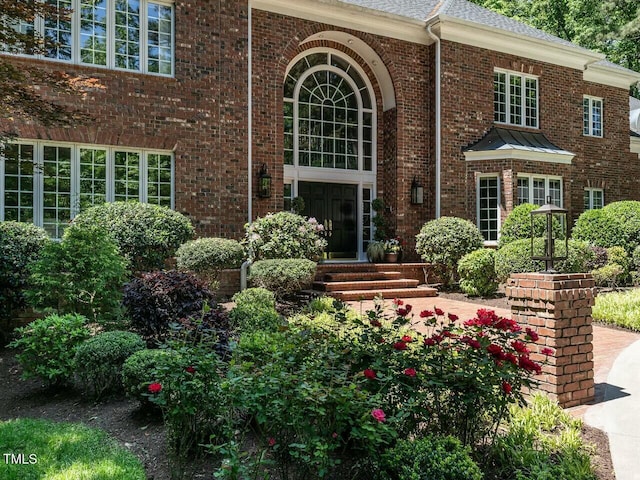 exterior space featuring brick siding