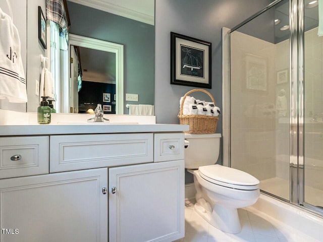 full bath with crown molding, toilet, a shower stall, vanity, and tile patterned floors