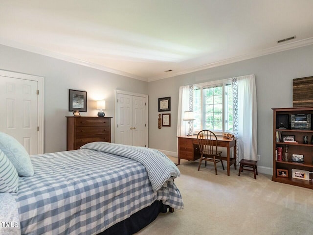 bedroom featuring baseboards, visible vents, light colored carpet, ornamental molding, and a closet