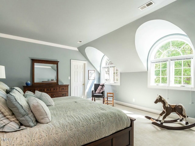 bedroom with lofted ceiling, baseboards, visible vents, and carpet flooring