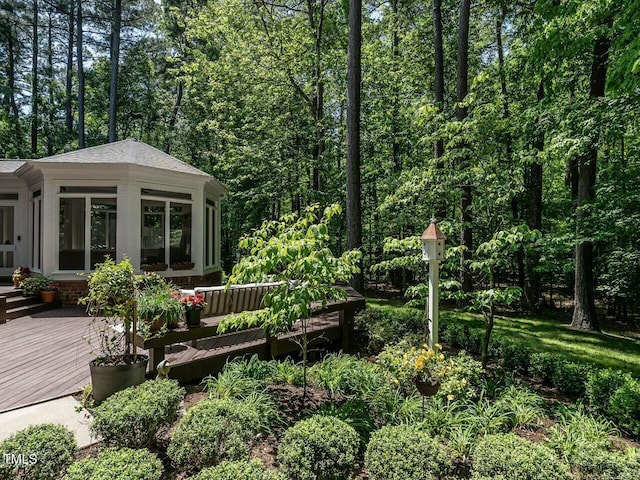 view of yard with a wooden deck