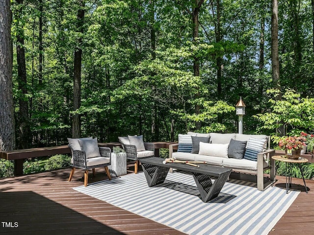 wooden deck featuring an outdoor hangout area