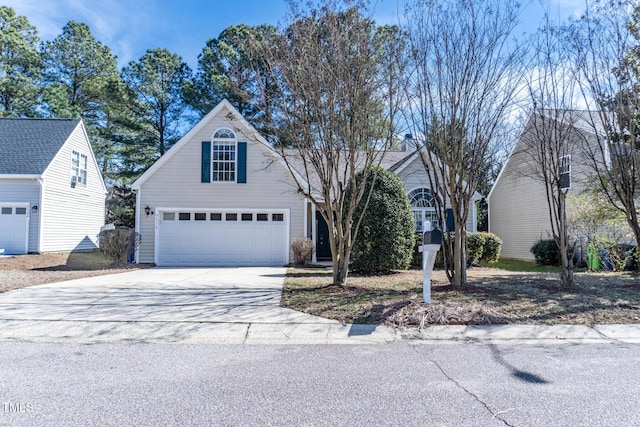 view of front of home featuring a garage and concrete driveway