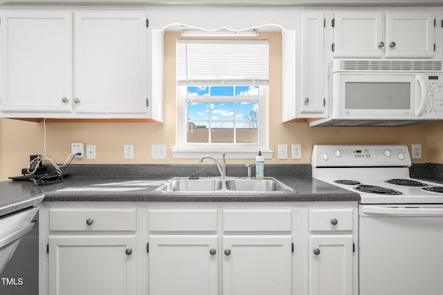 kitchen featuring white cabinetry, sink, and white appliances