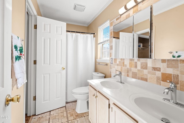 bathroom featuring crown molding, vanity, toilet, and backsplash