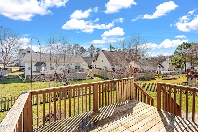 wooden terrace featuring a lawn