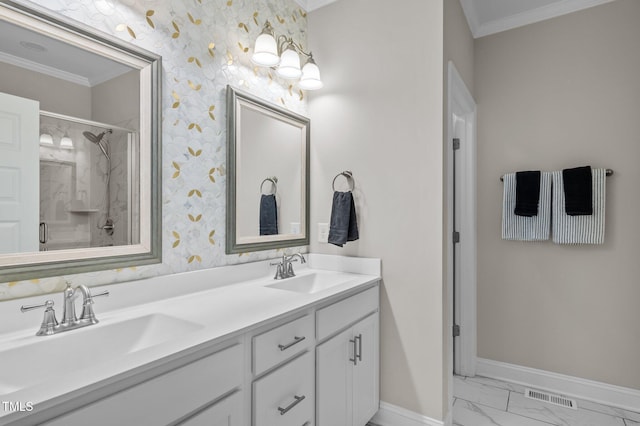 full bathroom featuring marble finish floor, wallpapered walls, visible vents, and a sink