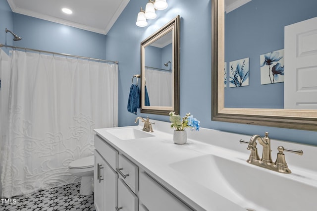 full bathroom featuring toilet, double vanity, ornamental molding, and a sink