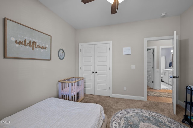 carpeted bedroom with a closet, ceiling fan, and baseboards