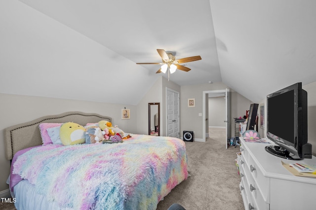 bedroom with lofted ceiling, light colored carpet, ceiling fan, and baseboards