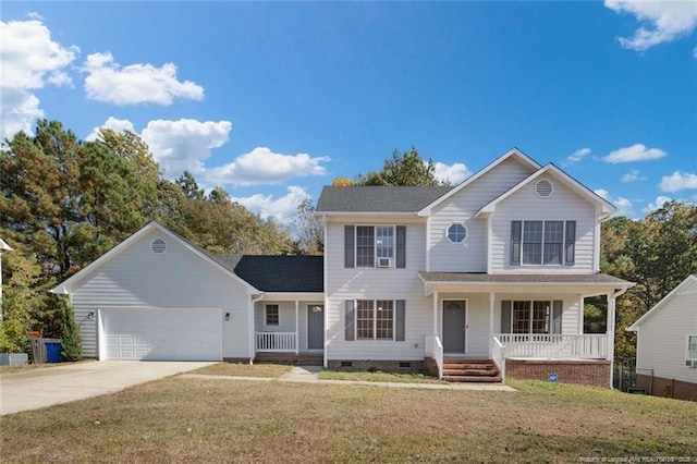 front of property with a garage, a porch, and a front lawn