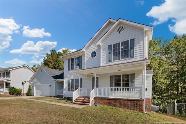 view of front of home with a garage, a front yard, and a porch