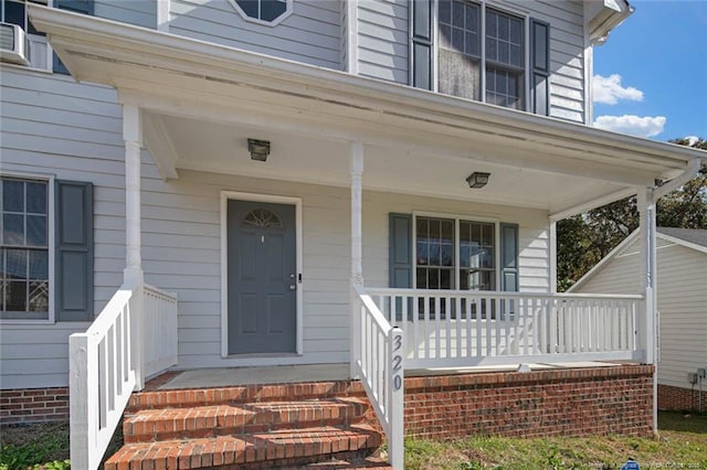 doorway to property featuring a porch